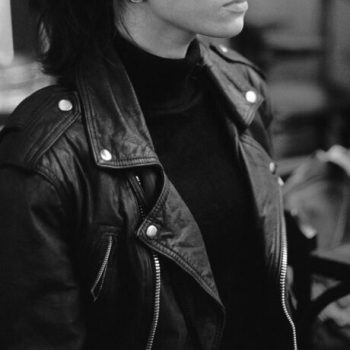 pexels photo 4514348 4514348 Black and white calm attractive female wearing stylish leather jacket standing on blurred interior of cafeteria and thoughtfully looking away